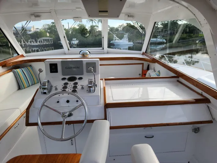Miss Phebe II Yacht Photos Pics 1971 Whiticar Sportfish boat interior with steering wheel and control panel.