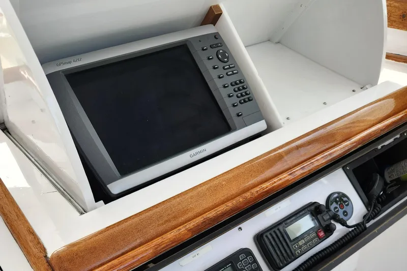 Miss Phebe II Yacht Photos Pics 1971 Whiticar Sportfish boat dashboard with Garmin GPS and communication equipment.