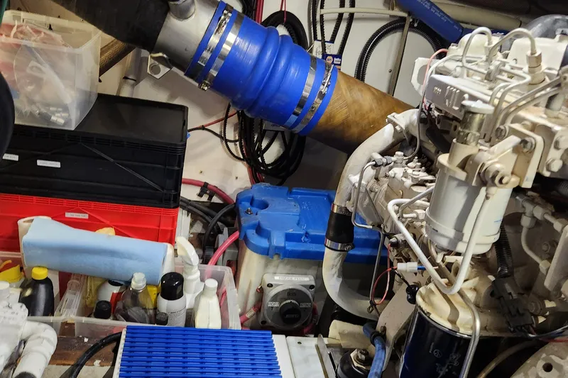 Miss Phebe II Yacht Photos Pics Engine room of a 1971 Whiticar Sportfish boat, featuring various mechanical components and equipment.