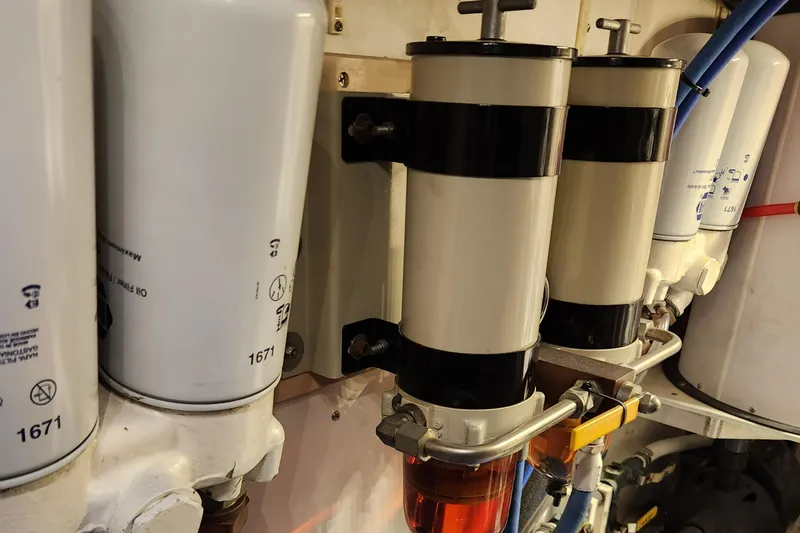 Miss Phebe II Yacht Photos Pics Engine components of a 1971 Whiticar Sportfish boat, featuring fuel filters and oil filters.