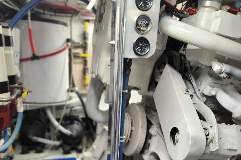 Miss Phebe II Yacht Photos Pics Engine room of a 1971 Whiticar Sportfish boat, showcasing mechanical components and gauges.