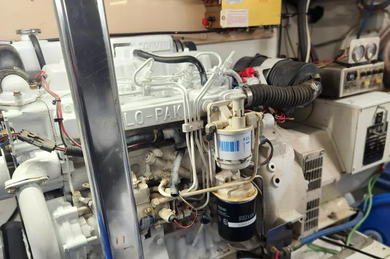 Miss Phebe II Yacht Photos Pics Engine room of a 1971 Whiticar Sportfish boat, showcasing detailed mechanical components.