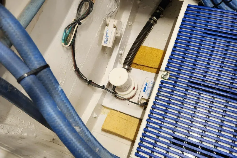 Miss Phebe II Yacht Photos Pics 1971 Whiticar Sportfish engine room with blue hoses and wiring.