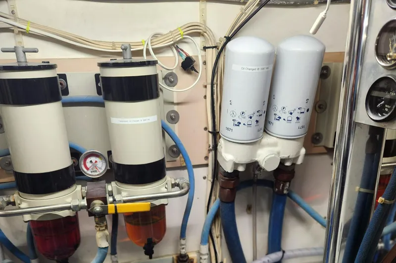 Miss Phebe II Yacht Photos Pics Engine room of a 1971 Whiticar Sportfish boat showing fuel filters and piping.