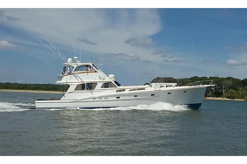 Miss Phebe II Yacht Photos Pics 1971 Whiticar Sportfish yacht cruising on a sunny day, showcasing classic design and elegance.