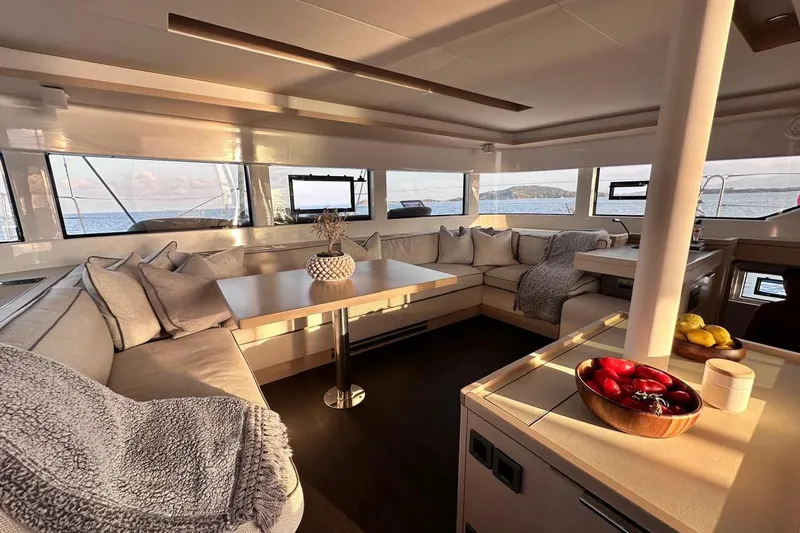  Yacht Photos Pics Luxurious interior of 2021 Lagoon 50 yacht with elegant seating and ocean view.
