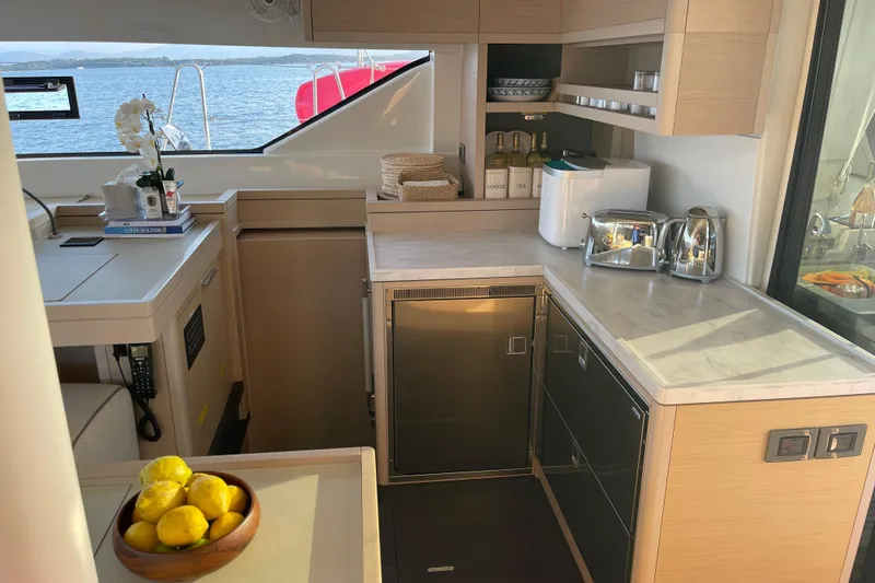  Yacht Photos Pics Modern kitchen interior on 2021 Lagoon 50 yacht with sea view.