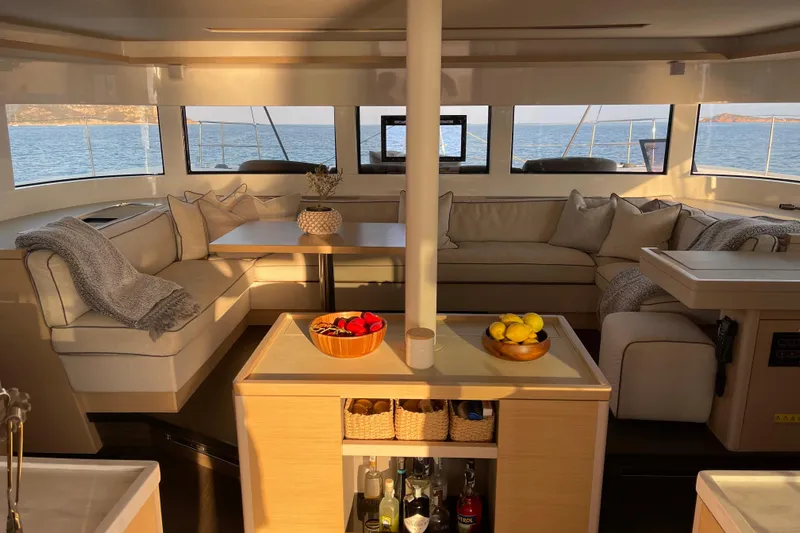  Yacht Photos Pics Luxurious interior of 2021 Lagoon 50 catamaran with elegant seating and ocean view.
