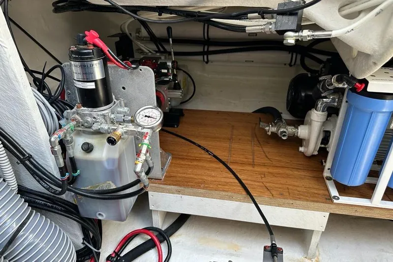  Yacht Photos Pics Engine compartment of a 2021 Lagoon 50 yacht, featuring hydraulic and filtration systems.