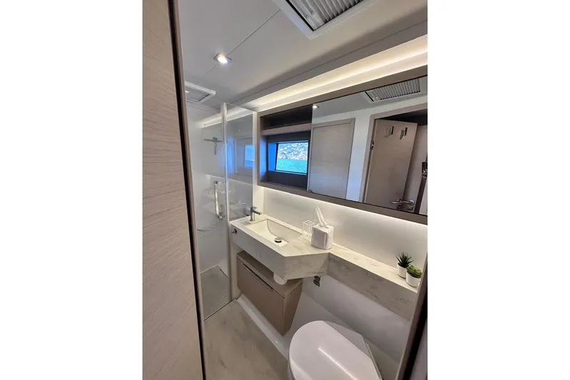  Yacht Photos Pics Modern bathroom interior of 2021 Lagoon 50 yacht, featuring sleek design and elegant fixtures.