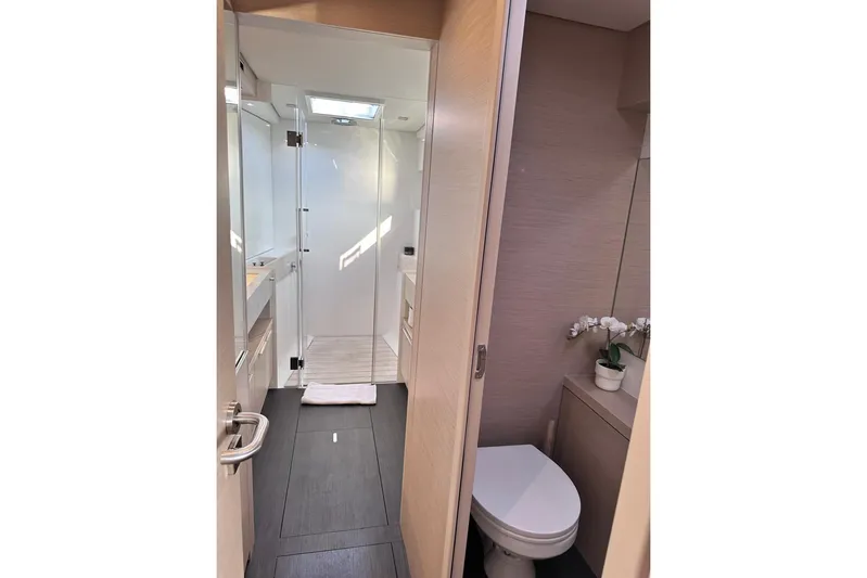  Yacht Photos Pics Modern bathroom interior on 2021 Lagoon 50 yacht, featuring sleek design and elegant fixtures.