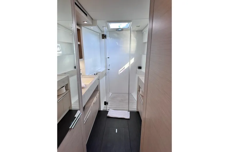  Yacht Photos Pics Modern bathroom interior of 2021 Lagoon 50 yacht, featuring sleek design and ample lighting.