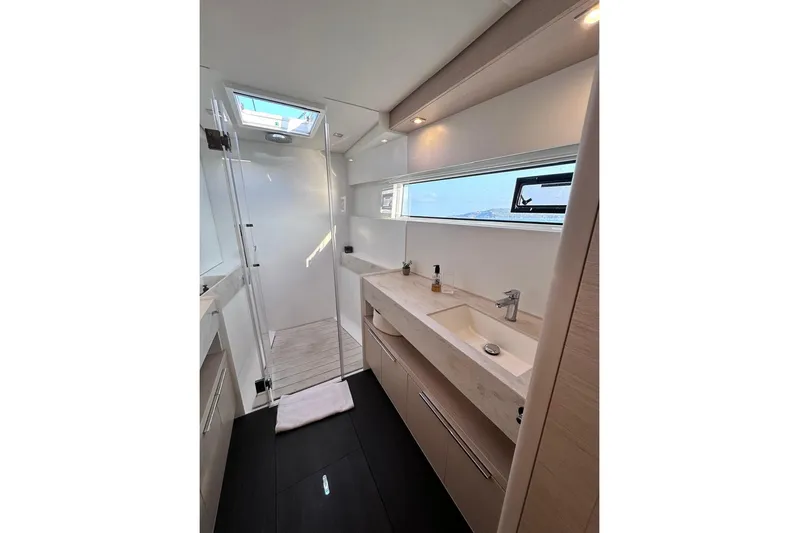  Yacht Photos Pics Modern bathroom interior of 2021 Lagoon 50 yacht with sleek design and natural lighting.