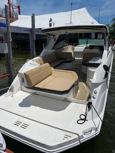 2023 Sea Ray Sundancer 320 @ Imp Def Yacht Photos Pics 2023 Sea Ray Sundancer 320 yacht docked, featuring spacious seating and modern design.