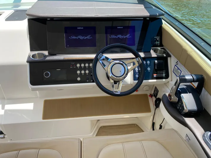 2023 Sea Ray Sundancer 320 @ Imp Def Yacht Photos Pics 2023 Sea Ray Sundancer 320 helm with modern controls and dual displays.