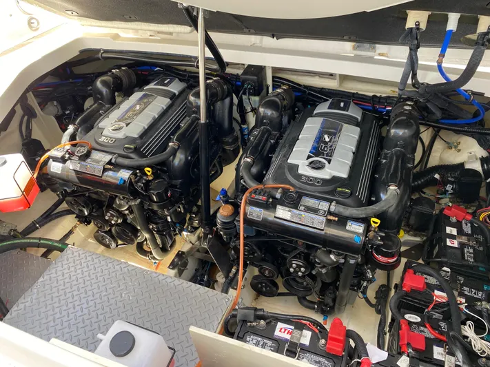 2023 Sea Ray Sundancer 320 @ Imp Def Yacht Photos Pics 2023 Sea Ray Sundancer 320 engine compartment with dual engines and battery setup.