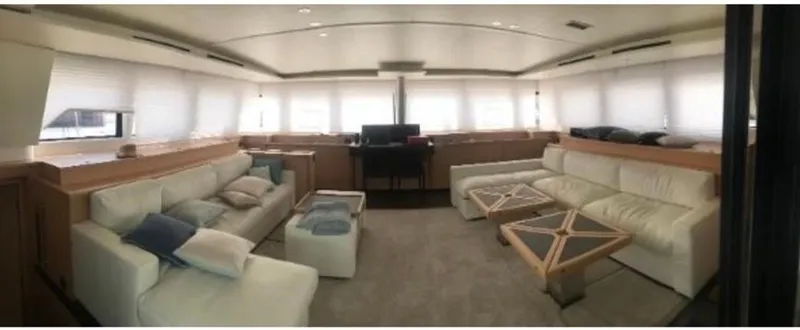 Sunset O Yacht Photos Pics Luxurious interior of 2019 Lagoon 620 yacht with elegant seating and modern decor.