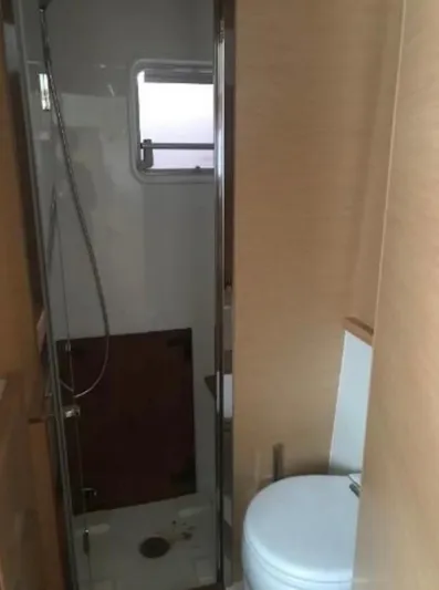 Sunset O Yacht Photos Pics 2019 Lagoon 620 yacht bathroom with shower and toilet.