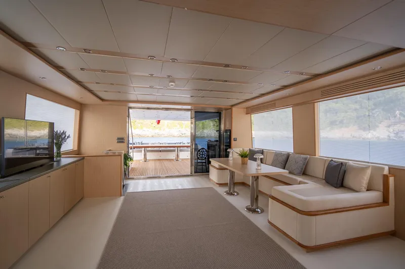  Yacht Photos Pics Luxurious interior of 2024 Custom 27m Trawler with modern seating and large windows.