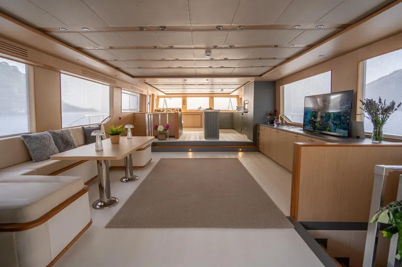  Yacht Photos Pics Luxurious interior of a 2024 Custom 27m Trawler with modern furnishings and large windows.
