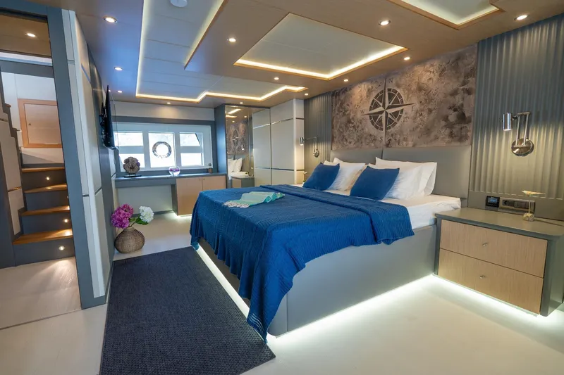  Yacht Photos Pics Luxurious bedroom interior of 2024 Custom 27m Trawler with modern design and ambient lighting.