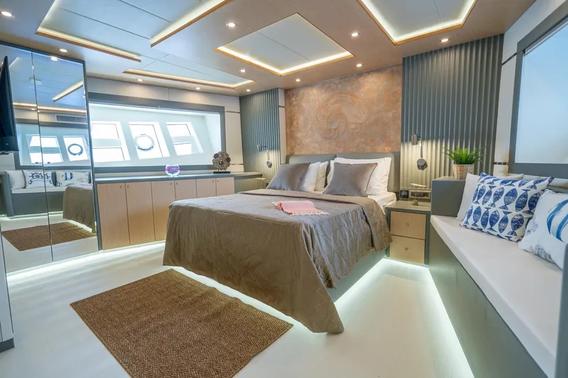  Yacht Photos Pics Luxurious bedroom interior of 2024 Custom 27m Trawler with modern design and ambient lighting.