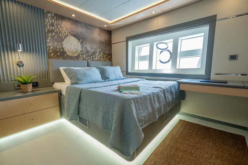  Yacht Photos Pics Luxurious bedroom interior of 2024 Custom 27m Trawler with modern decor and large window.