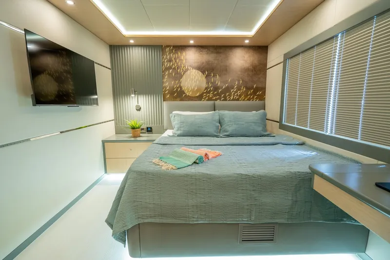  Yacht Photos Pics Luxurious bedroom interior of 2024 Custom 27m Trawler with modern decor and ambient lighting.