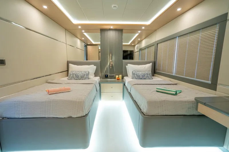  Yacht Photos Pics Luxurious twin cabin interior of 2024 Custom 27m Trawler yacht, featuring modern design and ambient lighting.