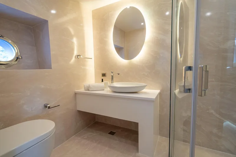  Yacht Photos Pics Luxurious bathroom on 2024 Custom 27m Trawler with modern fixtures and elegant design.