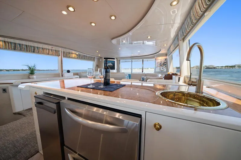 Octopi Yacht Photos Pics Luxurious interior of 1997 Lazzara EB 76 yacht with modern kitchen and ocean view.