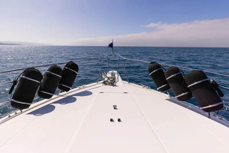 3ten Yacht Photos Pics Bow view of 1997 West Bay Sonship yacht cruising on open sea.