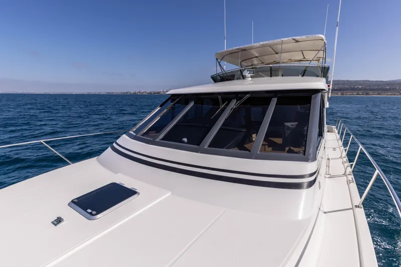 3ten Yacht Photos Pics 1997 West Bay Sonship yacht cruising on open water under clear blue skies.
