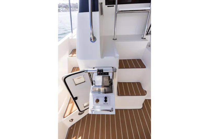 3ten Yacht Photos Pics 1997 West Bay Sonship yacht stairs with teak flooring and control panel.