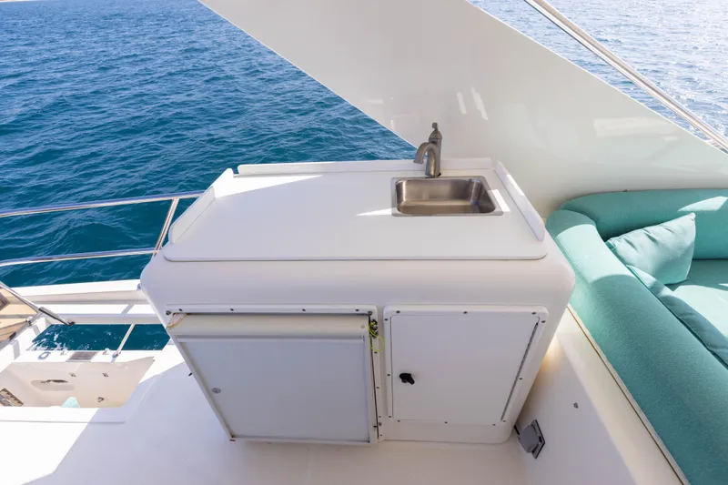 3ten Yacht Photos Pics Outdoor sink and seating area on 1997 West Bay Sonship yacht deck.