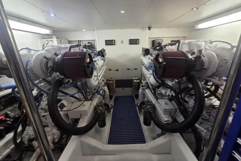 3ten Yacht Photos Pics Engine room of a 1997 West Bay Sonship yacht, featuring dual engines and clean layout.