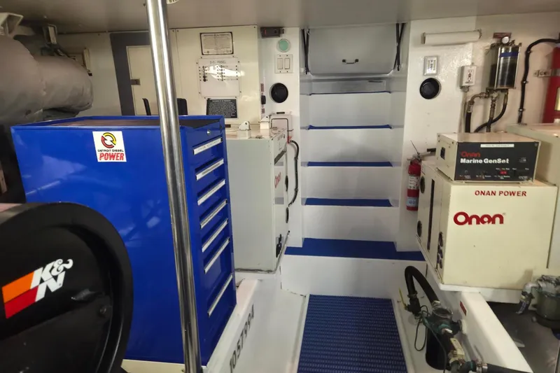 3ten Yacht Photos Pics Engine room of 1997 West Bay Sonship yacht with Onan Marine GenSet and tool storage.