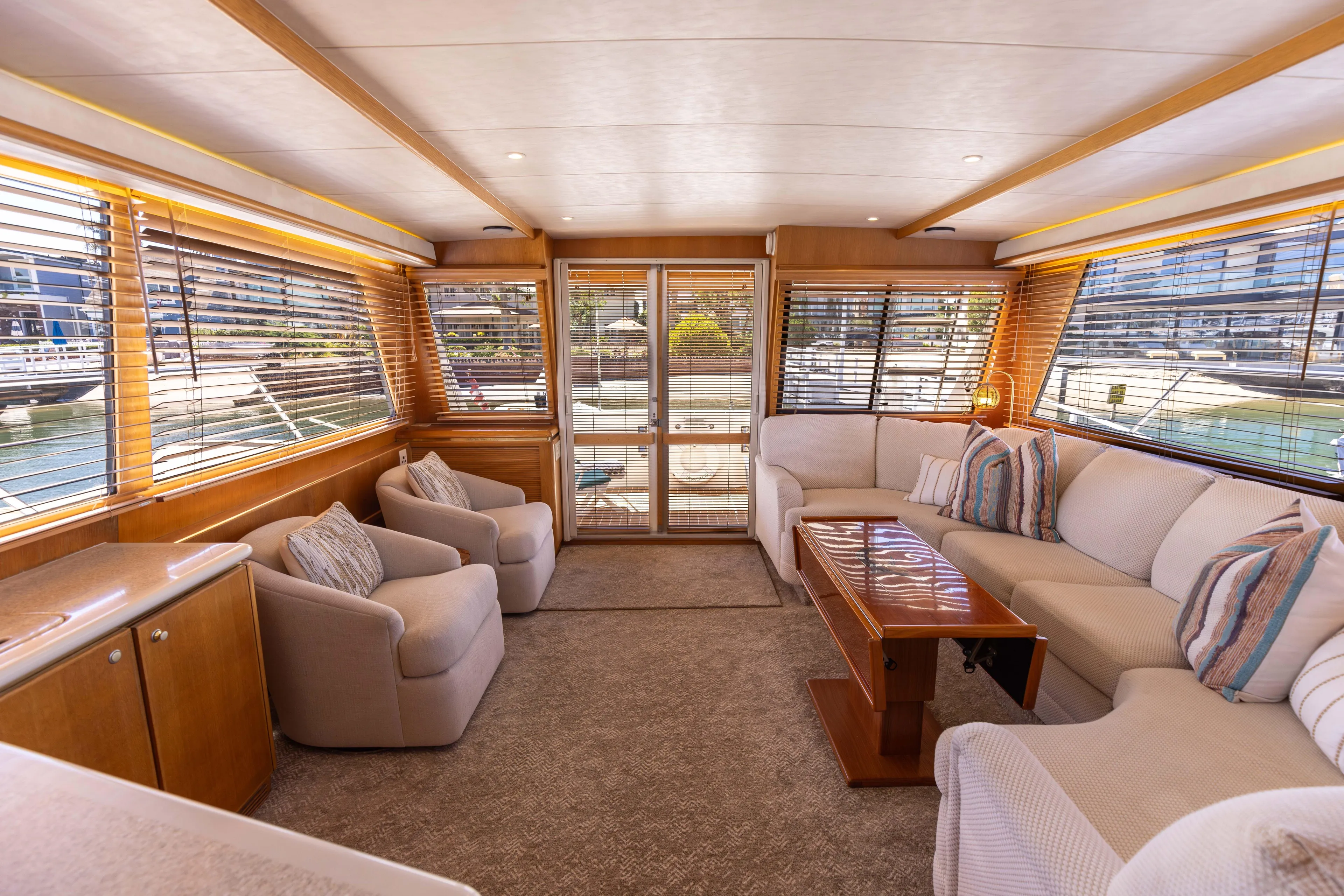 3ten Yacht Photos Pics Luxurious 1997 West Bay Sonship yacht interior with plush seating and elegant wood finishes.