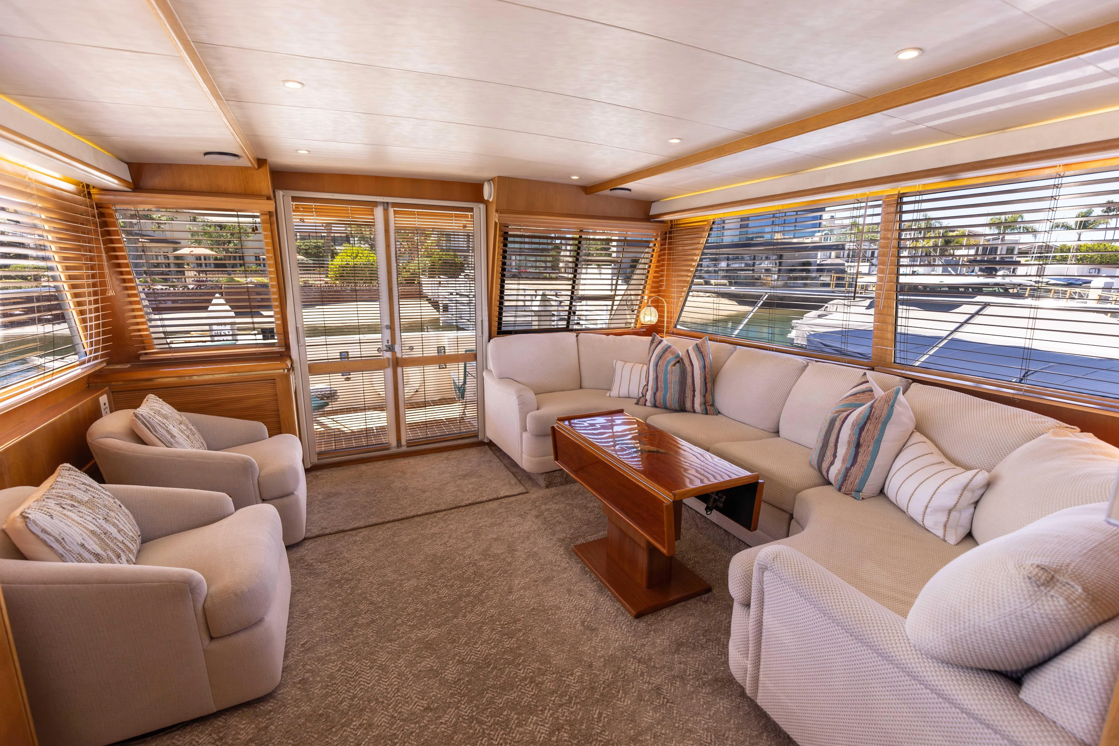3ten Yacht Photos Pics Luxurious 1997 West Bay Sonship yacht interior with plush seating and elegant wooden accents.
