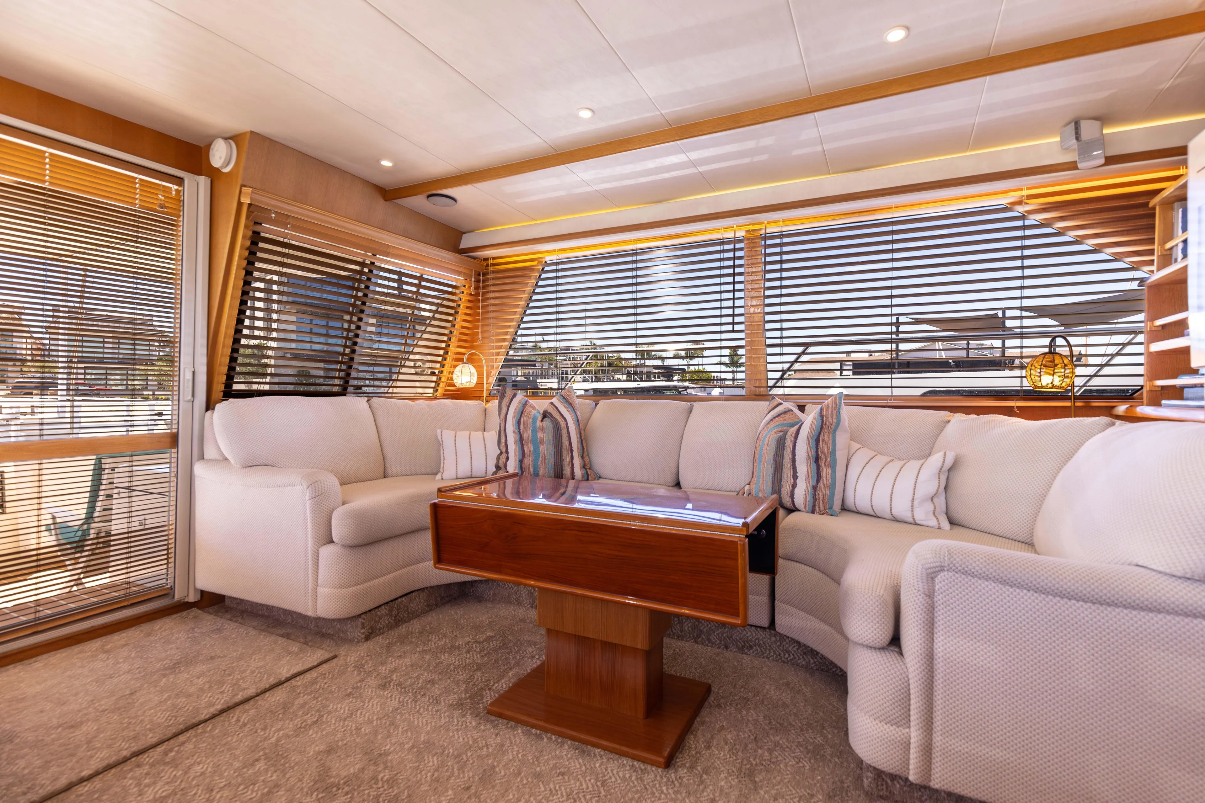 3ten Yacht Photos Pics Luxurious 1997 West Bay Sonship yacht interior with plush seating and elegant wooden table.