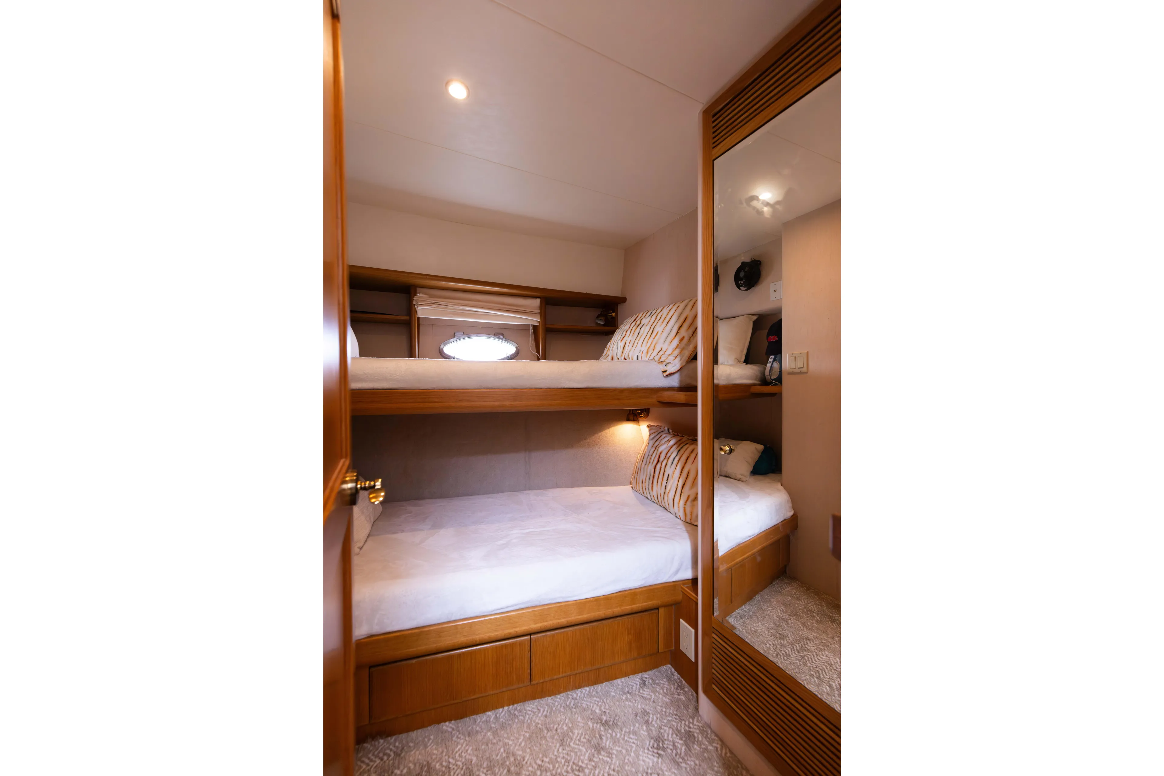 3ten Yacht Photos Pics Cozy bunk beds in 1997 West Bay Sonship yacht cabin, featuring wood accents and soft lighting.