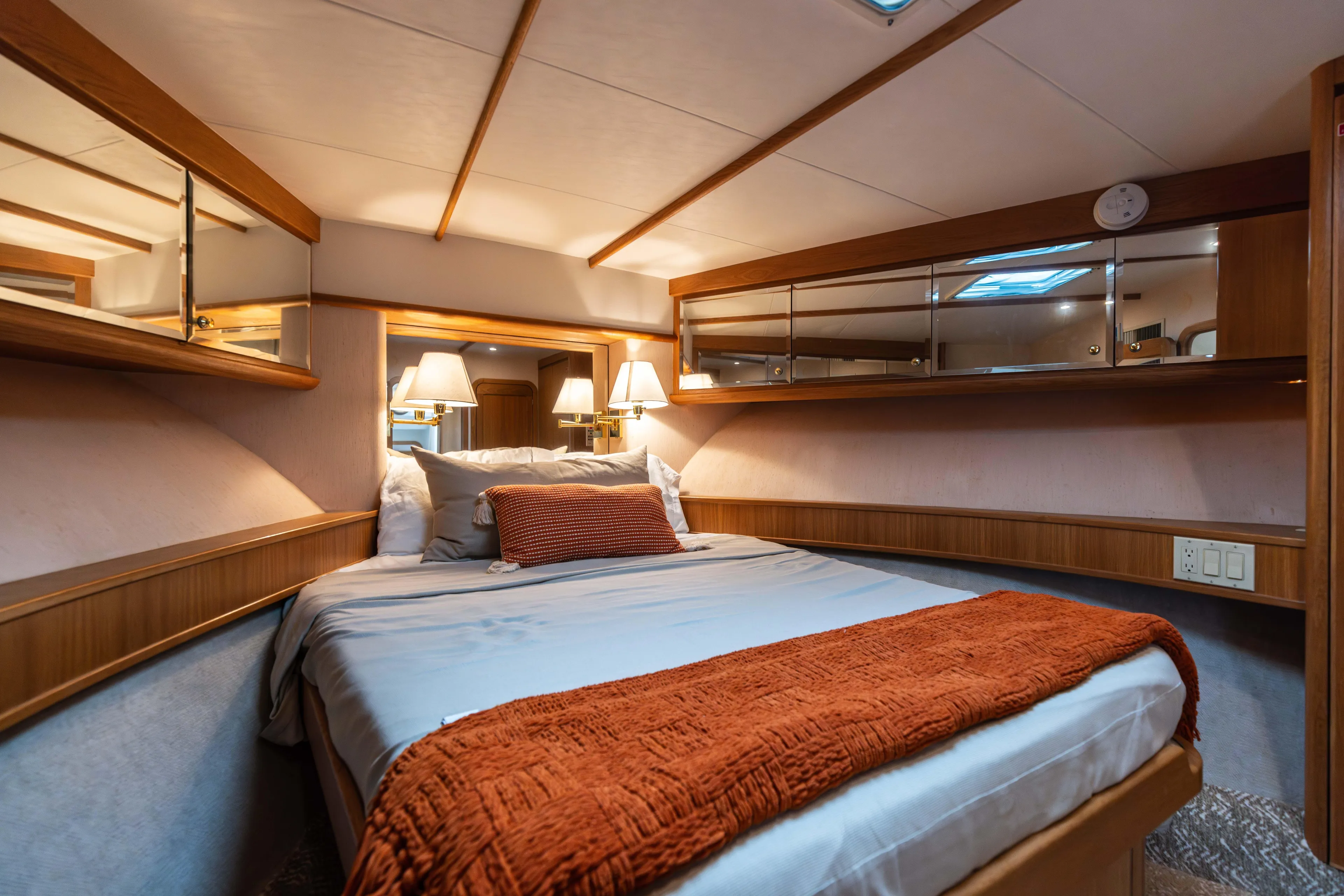 3ten Yacht Photos Pics Luxurious 1997 West Bay Sonship yacht bedroom with cozy bedding and elegant lighting.