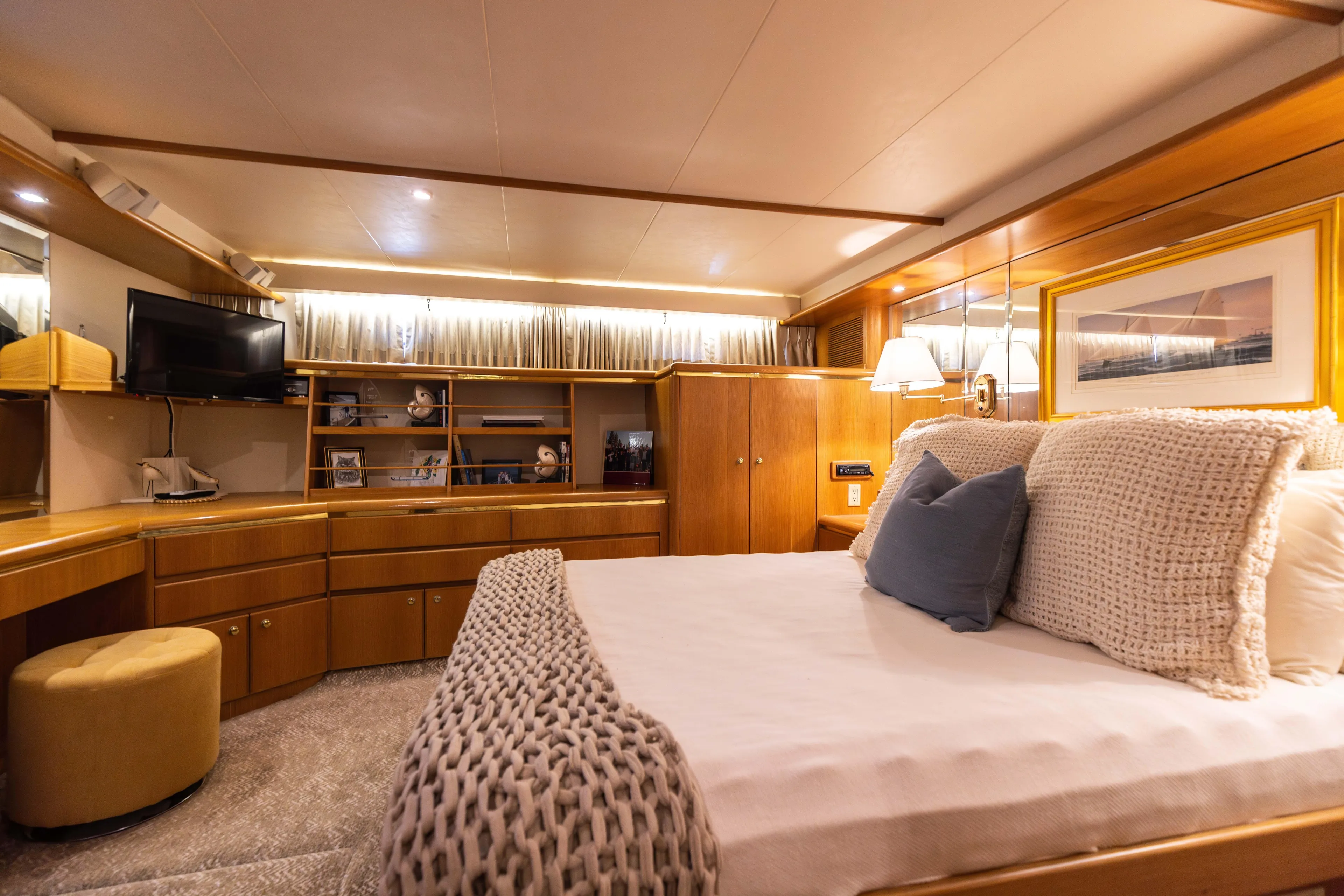 3ten Yacht Photos Pics Luxurious 1997 West Bay Sonship yacht bedroom with elegant wood furnishings and cozy bedding.