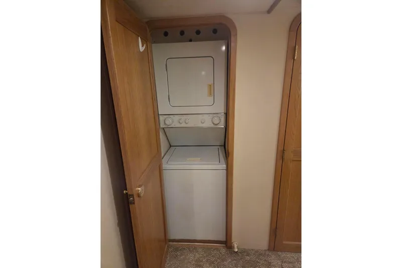3ten Yacht Photos Pics Stacked washer and dryer in 1997 West Bay Sonship yacht interior.