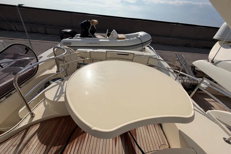  Yacht Photos Pics 2007 Azimut 68 EVO yacht deck with tender and seating area.