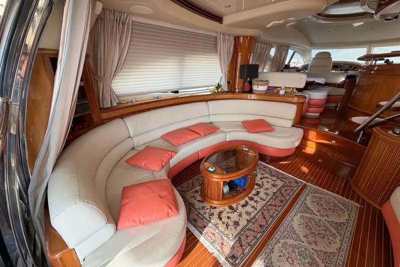  Yacht Photos Pics Luxurious interior of 2007 Azimut 68 EVO yacht with curved seating and elegant decor.