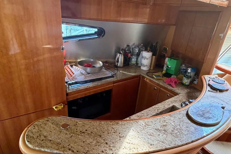  Yacht Photos Pics Luxurious kitchen interior of 2007 Azimut 68 EVO yacht with granite countertops.
