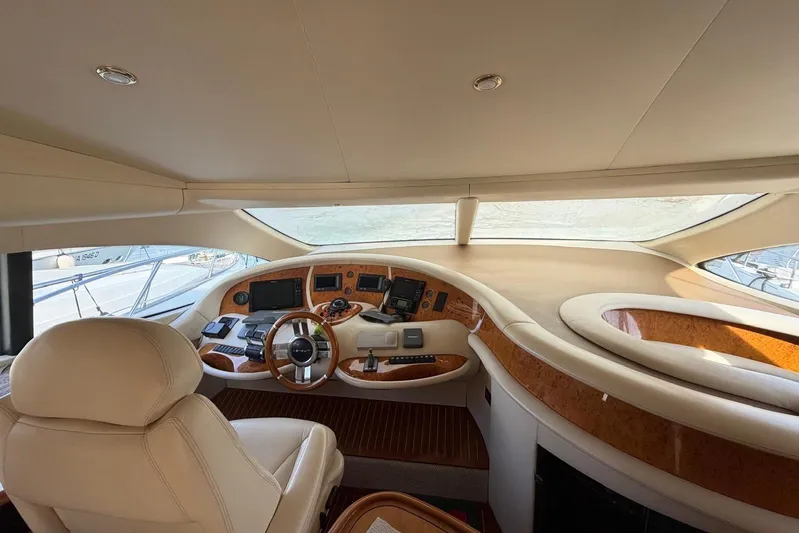  Yacht Photos Pics Luxurious interior of 2007 Azimut 68 EVO yacht with elegant helm and leather seating.