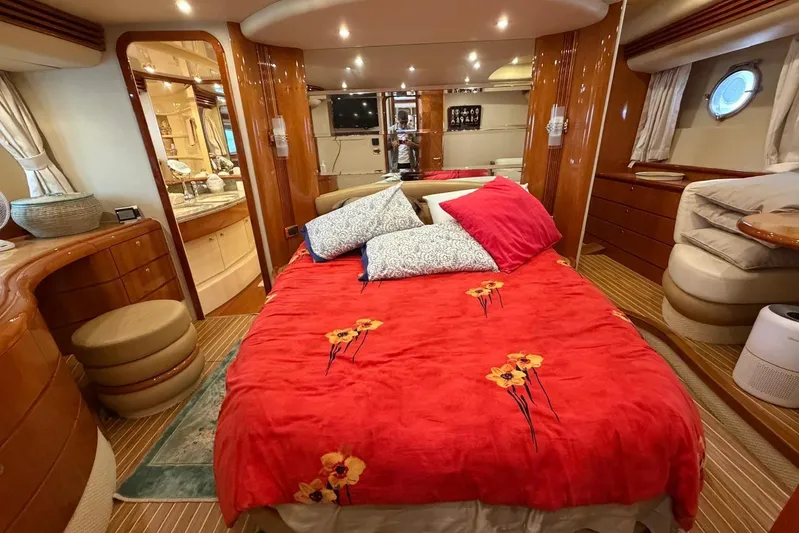  Yacht Photos Pics Luxurious bedroom interior of 2007 Azimut 68 EVO yacht with red floral bedding.