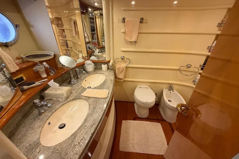  Yacht Photos Pics Luxurious bathroom in 2007 Azimut 68 EVO yacht with dual sinks and elegant fixtures.